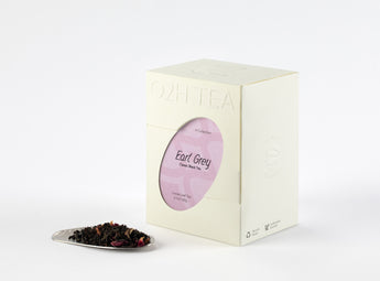 Display of Earl Grey Black Tea box alongside a sample of its finely cut black leaves infused with bergamot