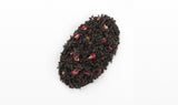 Loose Earl Grey Tea leaves intermixed with delicate bergamot orange peels, ready for a flavorful steep.