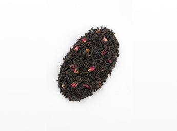 Loose Earl Grey Tea leaves intermixed with delicate bergamot orange peels, ready for a flavorful steep.