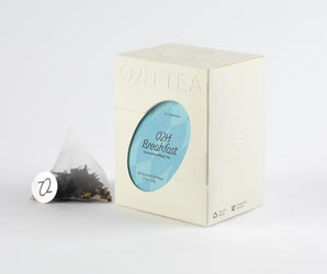 O2H Breakfast Tea box featuring Osmanthus English breakfast tea blend, with a tea bag visible on the side.