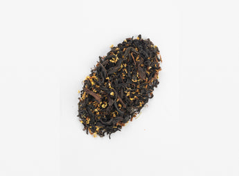 Close-up view of O2H Breakfast Tea's Osmanthus Black Tea blend, featuring refined black tea leaves and vibrant osmanthus petals.