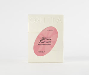 Sakura Strawberry Oolong Tea in an elegant package with a custom design showcasing the blend name through a transparent window.