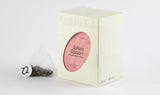 Pack of Sakura Strawberry Oolong Tea featuring a transparent tea bag with a blend of oolong, sakura blossoms, and strawberry pieces.