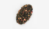 Detailed close-up of the Sakura Strawberry Oolong Tea blend, highlighting the delicate mixture of oolong tea leaves, strawberry pieces, and sakura petals.