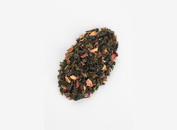 Detailed close-up of the Sakura Strawberry Oolong Tea blend, highlighting the delicate mixture of oolong tea leaves, strawberry pieces, and sakura petals.
