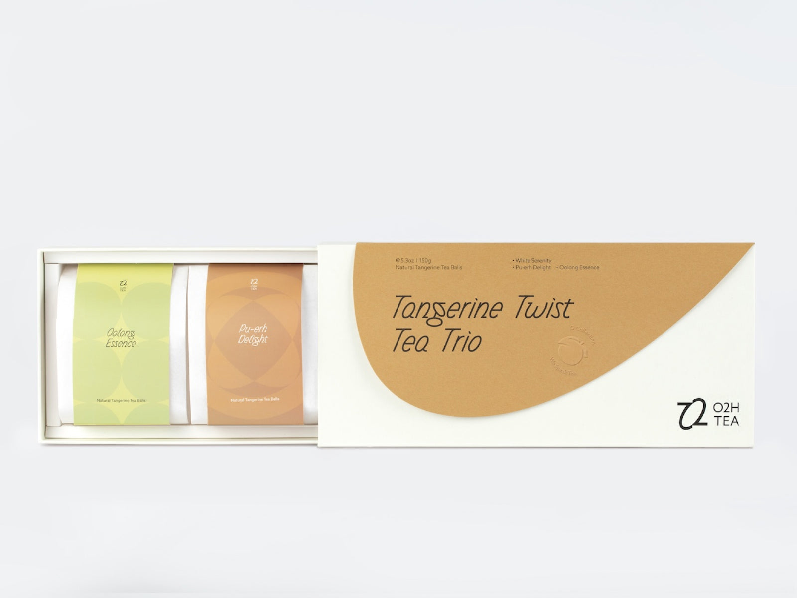 Open box display of O2H TEA Tangerine Twist Tea Trio, showcasing the premium selection of natural tangerine oolong, rich pu-erh, and delicate white tea