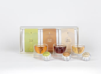 O2H TEA Tangerine Collection Set, featuring tangerine-infused oolong, pu-erh, and white tea, elegantly presented with transparent cups - the ideal tea gift set.